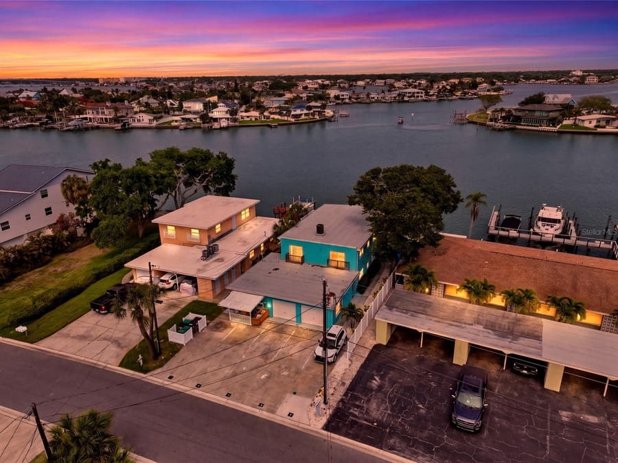Sunset aerial of the waterfront quadplex at 2311 Bay Blvd, Indian Rocks Beach, on the Intracoastal